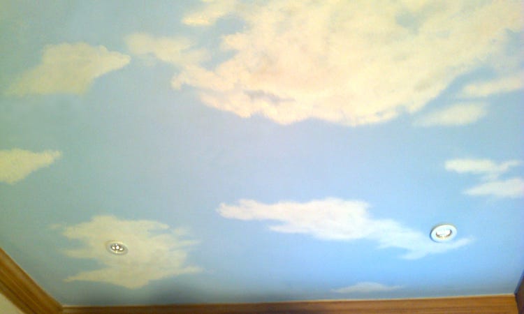 A realistic painting of clouds on a ceiling