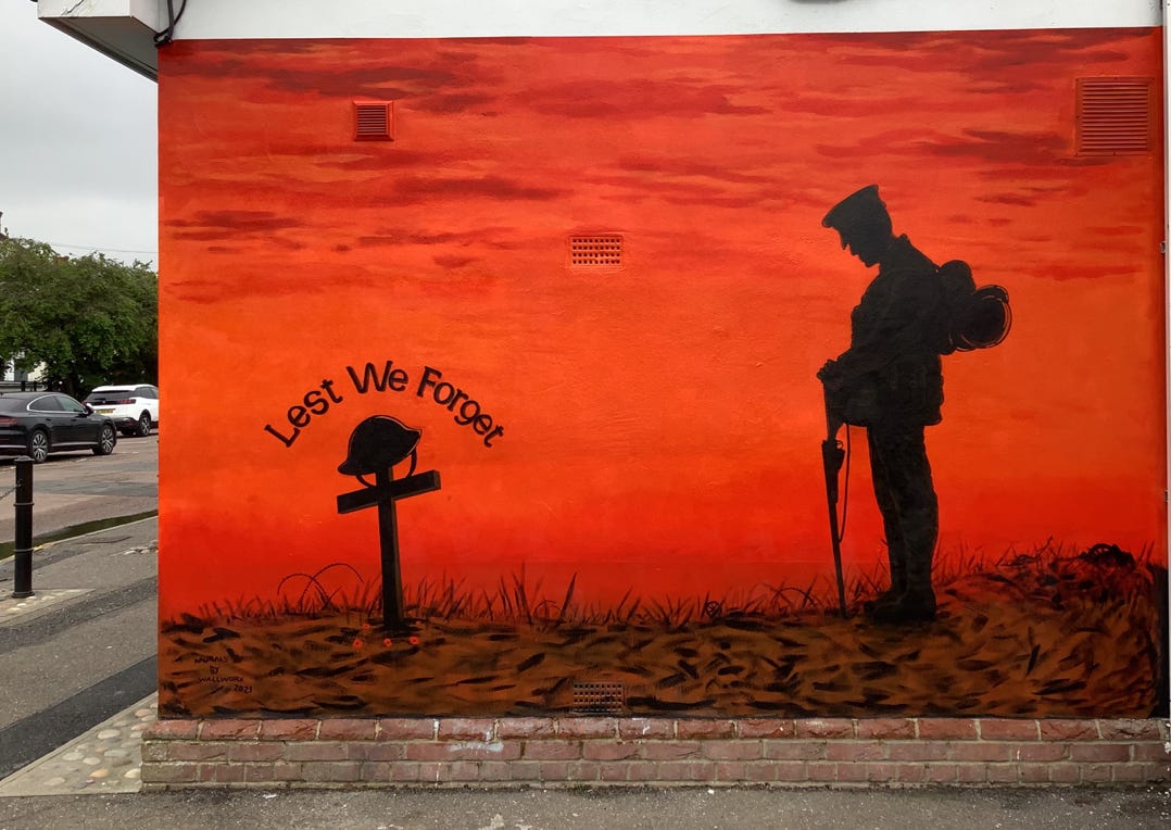 Mural of a WW1 Tommy at the Battlefield Grave of his comrade in arms